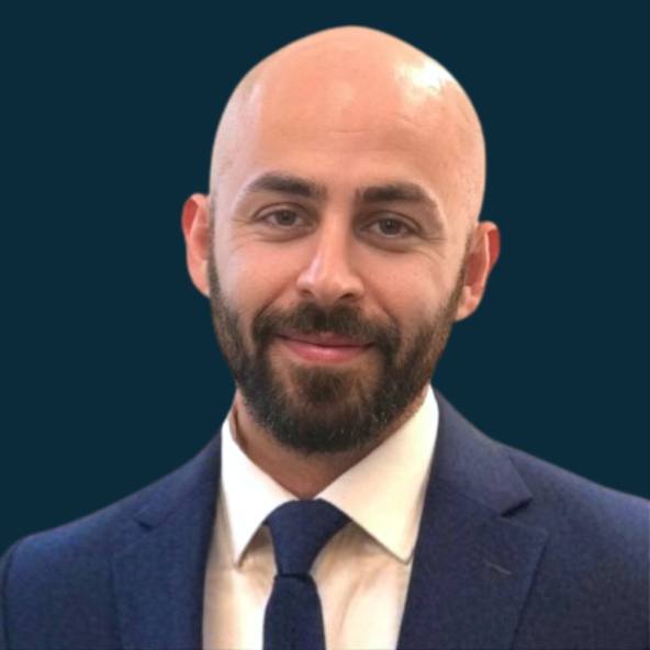 Ryan Rodriguez, founder of Leverup Liquidity, in a navy suit and tie