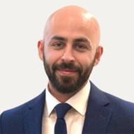 Ryan Rodriguez, founder of Leverup Liquidity, in a navy suit and tie
